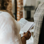 Bride reading vows during vow renewal at Happily Hitched Halifax