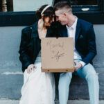 Couple sharing a pizza after their micro-wedding at Happily Hitched Halifax
