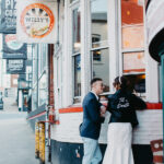 Couple ordering takeout at Pizza Corner after their microwedding at Happily Hitched Halifax