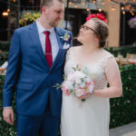 Couple posing on Argyle Street outside Happily Hitched Halifax